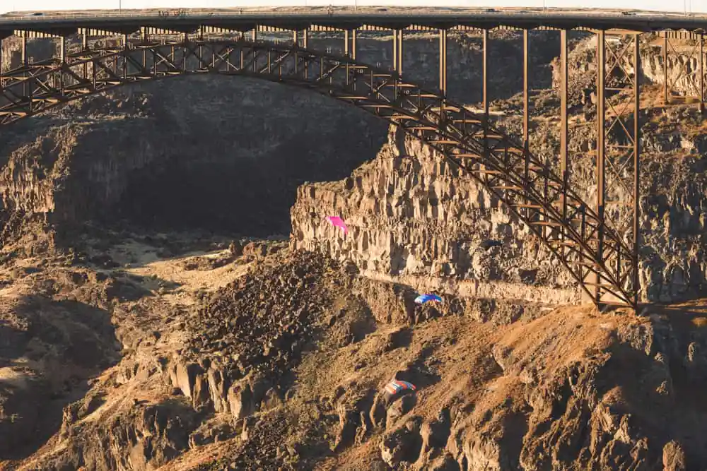 Base Jumpers Parachuting in the Snake River Canyon